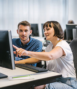 Two students at a PC